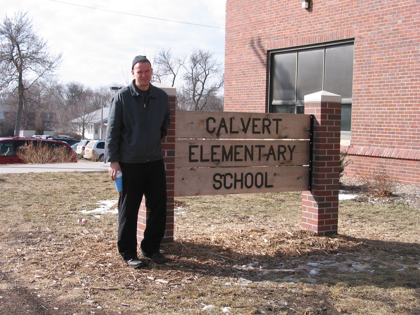 Lecture — Calvert Elementary School assembly, Lincoln, Nebraska, 2003: photograph 1 (Matt at the Calvert Elementary School sign, Lincoln, Nebraska, March 2003)