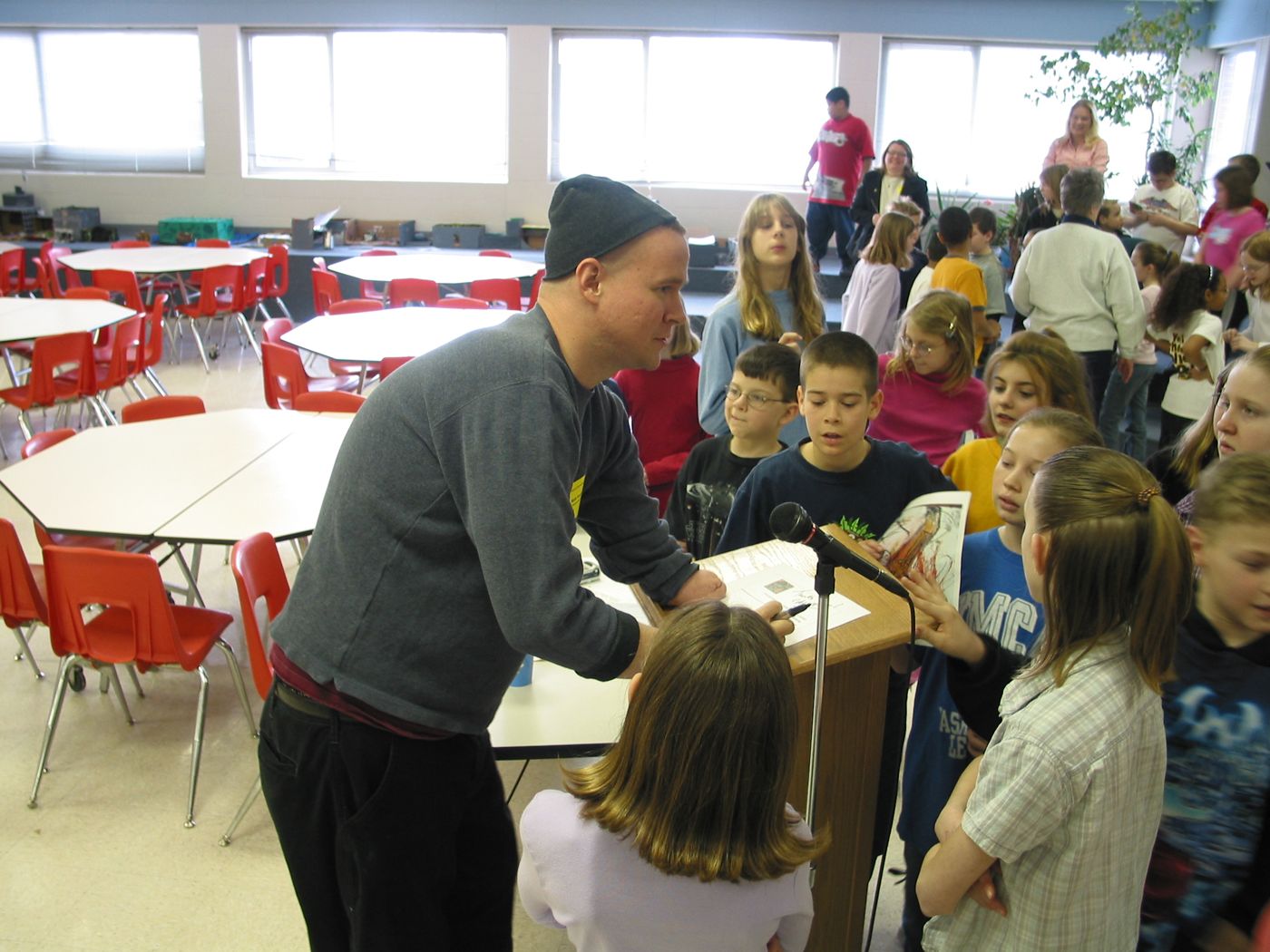 Lecture — Calvert Elementary School assembly, Lincoln, Nebraska, 2003: photograph 4 (After the talk, students line up for Matt’s autograph)