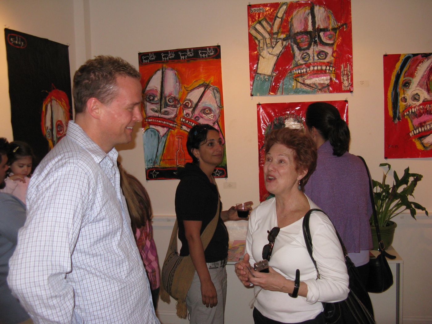 Art World News magazine — coverage of the “Super Men and Scoundrels” solo exhibition at the Gallery at Black…, 2010: photograph 3 (Opening reception, April 23, 2010)