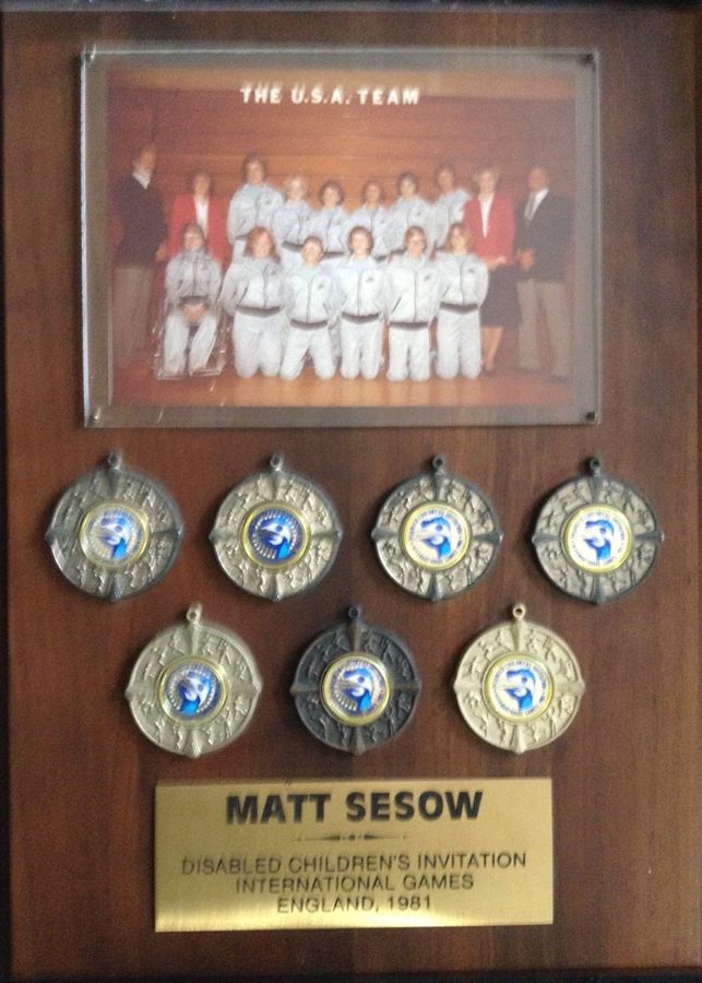 Matt Sesow's medals from the 1981 international games in Newcastle, England, mounted on a plaque