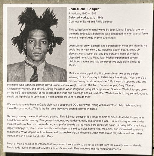 The wall label for the Basquiat works.