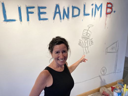 Dana at the title wall.
